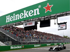 MONTREAL, QC - JUNE 12: Lewis Hamilton of Great Britain driving the (44) Mercedes AMG Petronas F1 Team Mercedes F1 WO7 Mercedes PU106C Hybrid turbo crosses the line to take the chequered flag and the win during the Canadian Formula One Grand Prix at Circuit Gilles Villeneuve on June 12, 2016 in Montreal, Canada.