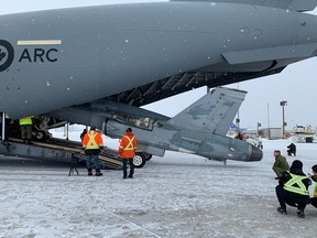 On Friday, Feb. 14, 2020, the Canadian Armed Forces posted a photo on Facebook of officials unloading the old fighter jet out of the massive cargo plane.