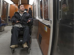 Martin Dion is seen riding the métro in 2017. The MR-73 trains like the one seen here don't line up properly with the station platforms, making it difficult for people in wheelchairs to get on at many stations.
