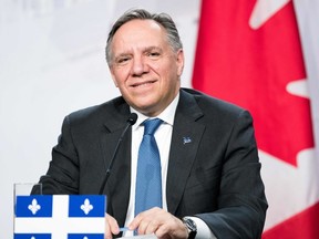 (FILES) In this file photo taken on December 7, 2018 Premier of Quebec François Legault looks on as prime ministers of the Canadian provinces gather for a meeting set-up by Canada prime minister Justin Trudeau in Montreal, at the Marriott Chateau Champlain. - Canada's Quebec province on March 28, 2019 unveiled controversial draft legislation that would ban a significant section of public servants from wearing religious symbols such as a crucifix, yarmulke or hijab. The measure -- which applies to police, teachers and others in positions of authority -- is expected to become law by June with Premier Francois Legault's government holding a majority of seats in the Quebec legislature.