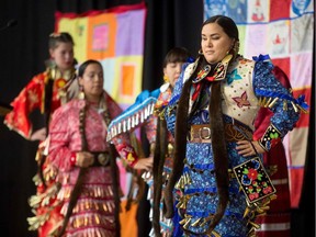 Jingle Dancers perform at the closing ceremony marking the conclusion of the National Inquiry into Missing and Murdered Indigenous Women and Girls at the Museum of History in Gatineau, Quebec on June 3, 2019. - After two and a half years of hearings, a Canadian inquiry released its final report on the disappearance and death of hundreds, if not thousands of indigenous women, victims of endemic violence it controversially said amounted to "genocide."