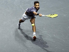 Félix Auger-Aliassime from Montreal returns a ball to Pablo Carreno Busta from Spain during the semi-final of the ABN AMRO World Tennis Tournament in Rotterdam, Netherlands, on Saturday, Feb. 15, 2020.