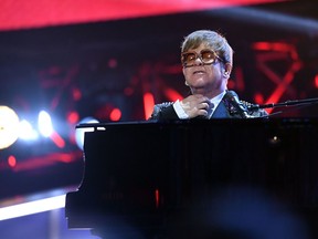 Elton John performs on stage during the "Elton John: I'm Still Standing - A GRAMMY Salute" concert at The Theater at Madison Square Garden in New York. Elton John has tearfully apologized to fans after cutting short a concert in New Zealand due to illness, with the British superstar saying he was suffering from "walking pneumonia" on February 17, 2020.