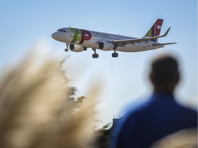 (FILES) In this file photo taken on October 3, 2018, a plane of Portuguese TAP airline prepares to land at Humberto Delgado airport in Lisbon on October 3, 2018. - Venezuela on February 17, 2020, suspended TAP's operations in Venezuela for 90 days, after accusing it of allowing a family member of opposition leader Juan Guaidó to travel with explosives, announced Transport Minister Hipolito Abreu. (Photo by PATRICIA DE MELO MOREIRA / AFP)