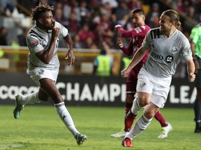 Impact player Orji Okwonkwo, left,  Samuel Piette celebrate against Deportivo Saprissa during their CONCACAF Champions League match last week. Okwonkwo was injured in the game and won't play on Wednesday at Olympic Stadium.