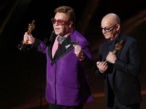 Elton John and Bernie Taupin win the Oscar for Best Original Song for (I'm Gonna) Love Me Again from Rocketman at the 92nd Academy Awards in Hollywood on Sunday, Feb. 9, 2020.