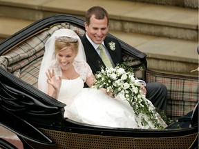 FILE PHOTO: Britain's Peter Phillips (R) and Canada's Autumn Kelly leave St George's Chapel after their marriage in Windsor, southern England on May 17, 2008.  REUTERS/Sang Tan/Pool/File Photo