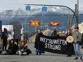 Supporters of the indigenous Wet'suwet'en Nation's hereditary chiefs block the entrance to the Port of Vancouver at Hastings street and Clark Drive, as part of protests against the Coastal GasLink pipeline, in Vancouver, British Columbia, Canada February 24, 2020.  REUTERS/Jennifer Gauthier