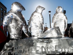 A Greenpeace ice sculpture of penguins is seen during a protest by students against climate change in central Brussels, Belgium, on Friday, Feb. 7, 2020.