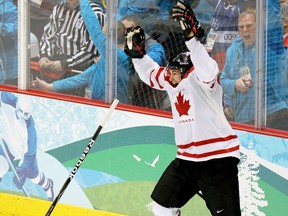 Sidney Crosby celebrates after scoring in overtime to give Canada a 3-2 win over the United States in the gold-medal hockey game at the Olympic Games in Vancouver on Feb. 28, 2010.
