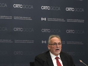 CRTC Chair Ian Scott is seen at the start of the first day of hearings on mobile wireless service, Tuesday February 18, 2020 in Gatineau, Que. "It is the most far-reaching review of the wireless industry since 2007, when the federal government decided to make it easier for new players to enter the mobile market," Pierre Karl Péladeau writes.