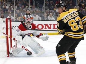 Canadiens goaltender Carey Price keeps an eye on Bruins' Brad Marchand and the loose puck during the second period Wednesday night at TD Garden in Boston.