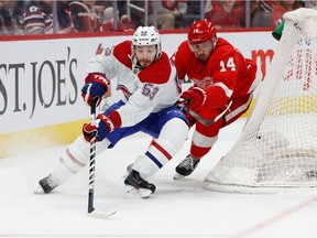 Canadiens defenceman Victor Mete skates with the puck chased by Wings' Robby Fabbri during first period Tuesday night in Detroit.