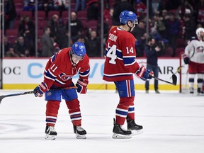 The Canadiens' Brendan Gallagher (left) and Nick Suzuki react after 4-3 loss to the Columbus Blue Jackets at the Bell Centre in Montreal on Feb. 2, 2020.