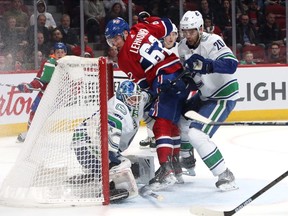 Vancouver Canucks goalie Thatcher Demo makes save with Canadiens forward Artturi Lehkonen in his crease during NHL game at the Bell Centre in Montreal on Feb. 25, 2020.