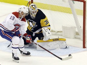 Penguins goaltender Tristan Jarry defends against Canadiens' Max Domi during the second period at PPG PAINTS Arena on Friday, Feb. 14, 2020, in Pittsburgh.