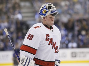 Carolina Hurricanes emergency goaltender David Ayres takes a break  in the action against the Maple Leafs on Saturday, Feb. 22, 2020, in Toronto.