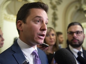 Simon Jolin-Barrette Quebec Minister of Immigration, Diversity and Inclusiveness, responds to questions at a news conference on Tuesday, Feb. 4, 2020 at the legislature in Quebec City.