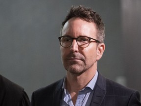 Former radio and television personality Eric Salvail walks the halls of the courthouse in Montreal on Monday, February 17, 2020.