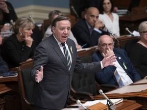 Premier Francois Legault responds to the Opposition, during question period Tuesday, February 18, 2020 at the legislature in Quebec City. Legault in the past opposed extending Bill 101 to cover businesses of 26 to 49 employees. This week, CAQ MNAs voted in favour of a PQ motion calling for legislation to extend Bill 101 francization rules to businesses with 25 to 49 employees and to those under federal jurisdiction.