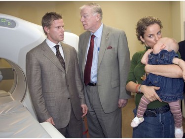 Montreal Canadiens captain Saku Koivu at the official opening of an advanced PET/CT (Positron Emission Tomography — Computed Tomography) facility in 2005 at the Montreal General Hospital with his wife, Hanna, baby Ilona and Dr. David Mulder, a member of the medical team who treated him when he had cancer. Money from Saku Koivu Foundation helped pay for the cancer equipment.