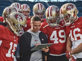 This undated image provided by Microsoft shows Katie Sowers, an offensive assistant coach with the San Francisco 49ers, in a scene from the company's 2020 Super Bowl NFL football spot.
