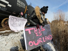 Supporters of the indigenous Wet'suwet'en Nation take a break during occupation of railway tracks, as part of a protest against British Columbia's Coastal GasLink pipeline, in Toronto, Ontario, Canada February 15, 2020.