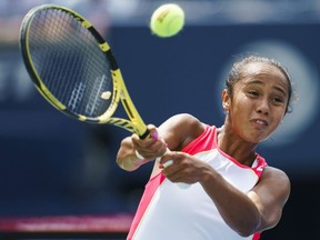 Leylah Annie Fernandez of Laval returns a shot to Marie Bouzkova of the Czech Republic at the Rogers Cup in Toronto on Aug. 5, 2019.