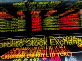 A sign board displaying Toronto Stock Exchange  information is seen in this file photo.