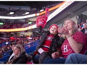 Lindsay Day and her 4-year-old son, Juliano Erbetta, watch the Canadiens Skills Competition at the Bell Centre in Montreal on Feb. 9, 2020.