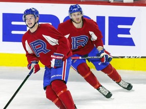 Nathanael Halbert, right, follows Jesperi Kotkaniemi through a drill during Laval Rocket practice at the Place Bell Sports Complex in Laval on Feb. 25, 2020.