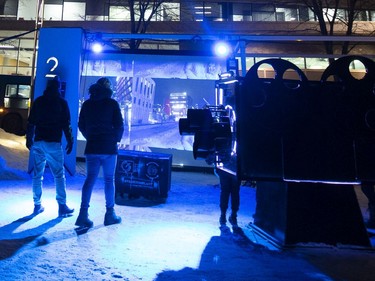 People participate in Nuit Blanche activities at the Quartier des Spectacles in Montreal on Saturday, Feb. 29, 2020.