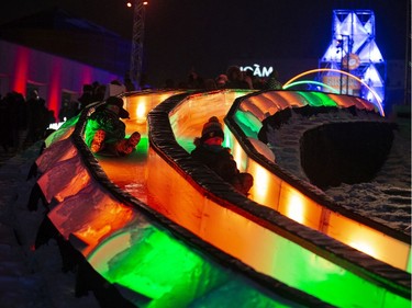 People participate in Nuit Blanche activities at the Quartier des Spectacles in Montreal on Saturday, Feb. 29, 2020.