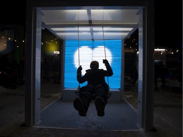 People participate in Nuit Blanche activities at the Quartier des Spectacles in Montreal on Saturday, Feb. 29, 2020.