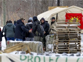 A group of Indigenous people from Sept-Îles visit the Mohawk barricade in Kahnawake, south of Montreal Monday March 2, 2020.