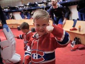 Boyd Petry, age 4, and his brother Barrett, 2, left, in the Canadiens' dressing room with their father, defenceman Jeff Petry, at the Bell Centre before a game against the Florida Panthers on Feb. 1, 2020.
