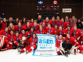 The McGill Martlets celebrate their Quebec university hockey league title after a 4-1 victory over the Université de Montréal Carabins in Game 2 at CEPSUM Arena on Saturday.