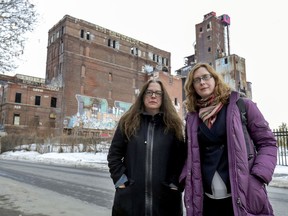 Luce Parisien, member of community group A Nous la Malting, left, and Shannon Franssen, coordinator of Solidarité St-Henri, are seen outside the former Canada Malting industrial site in Montreal's St-Henri district on Tuesday, March 3, 2020.