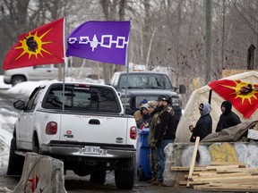 Though CP Rail has an injunction to clear the protest camp in Kahnawake, Mohawk police say they won't act against their people's sovereignty and the Sûreté du Québec hasn't shown any sign they'll move in on the territory.