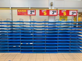 Empty bread shelves at the Maxi store in Pointe-Claire on Friday.