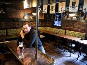 Rod Applebee, general manager of Hurley’s Irish Pub on Crescent St. in Montreal, sits alone on St. Patrick’s Day on March 17, 2020 after Premier François Legault announced all bars in the province must close as part of measures to combat the spread of COVID-19.