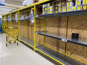 Empty toilet paper shelves at the Maxi store in Dorval last Friday.