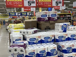 The Maxi store in Pointe-Claire posted a sign limiting people to buy two packages of toilet paper on sale, Thursday, March 14, 2020.