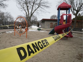 Playground at Beaubien Park is surrounded by police tape after all playgrounds in Montreal were shut down because of COVID-19 on March 23, 2020.