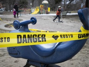 MONTREAL, QUE.: MARCH 23, 2020 --Kids make their way past playground at Westmount park after all playgrounds in the city have been close because of COVID-19 on Monday March 23, 2020. (Pierre Obendrauf / MONTREAL GAZETTE) ORG XMIT: 64141 - 1876
