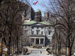 A lone figure is seen crossing the McGill University campus amid the coronavirus pandemic.