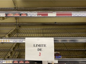 Despite limiting the amount of bread per client, shelves were still bare at a Montreal-area grocery store on March 24, 2020.