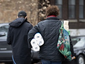 A shopper leaves a Montreal store during the coronavirus pandemic.