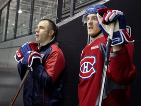 Pierre Allard, director of sports science for the Canadiens, left, with Habs winger Dale Weise in 2016, said that during the coronavirus crisis, the players have been given a program similar to the one they receive for off-season training.