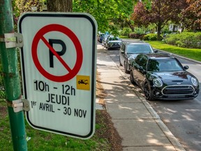 Parking signs in Outremont on Thursday May 30, 2019. Dave Sidaway / Montreal Gazette ORG XMIT: 62614